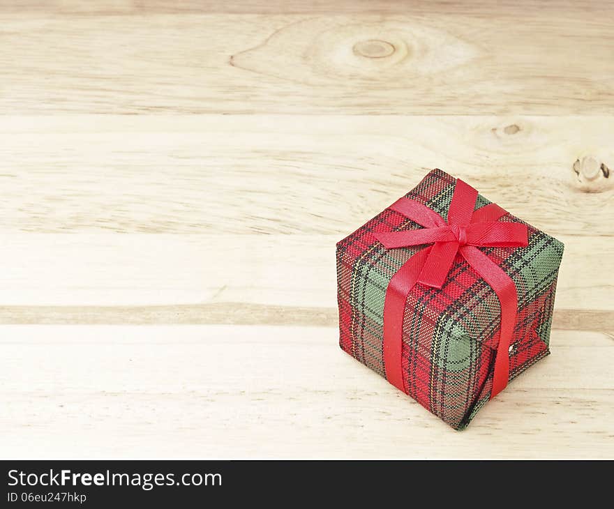 Red gift box decorate on wood background. Red gift box decorate on wood background