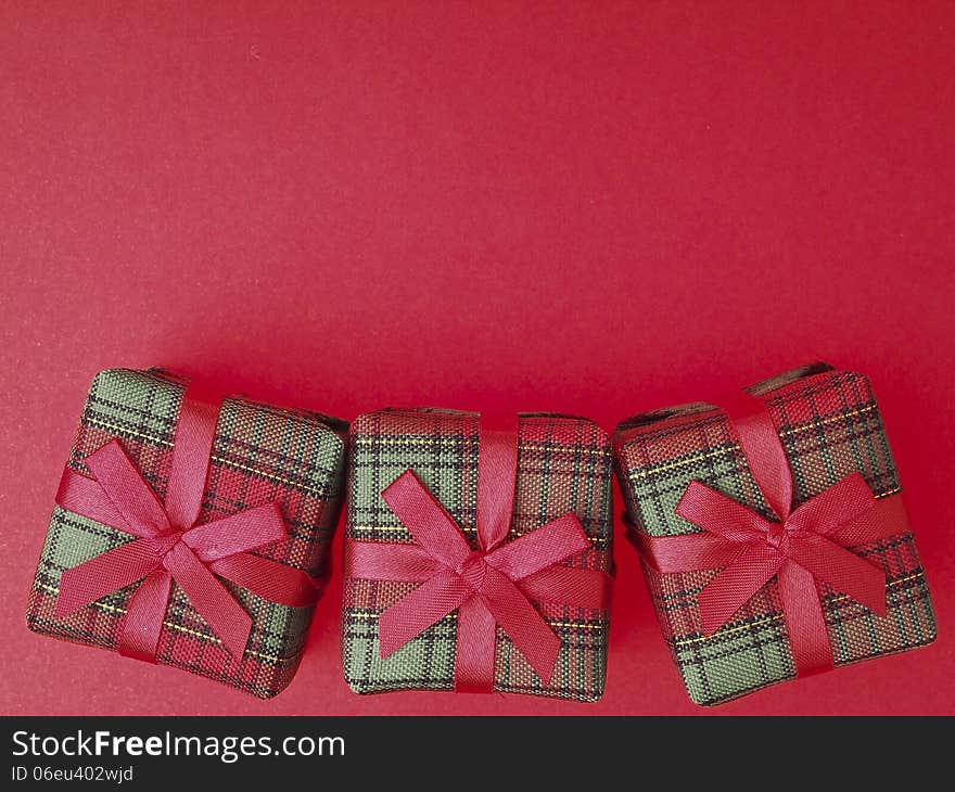 Three of red gift box decorate on red background. Three of red gift box decorate on red background