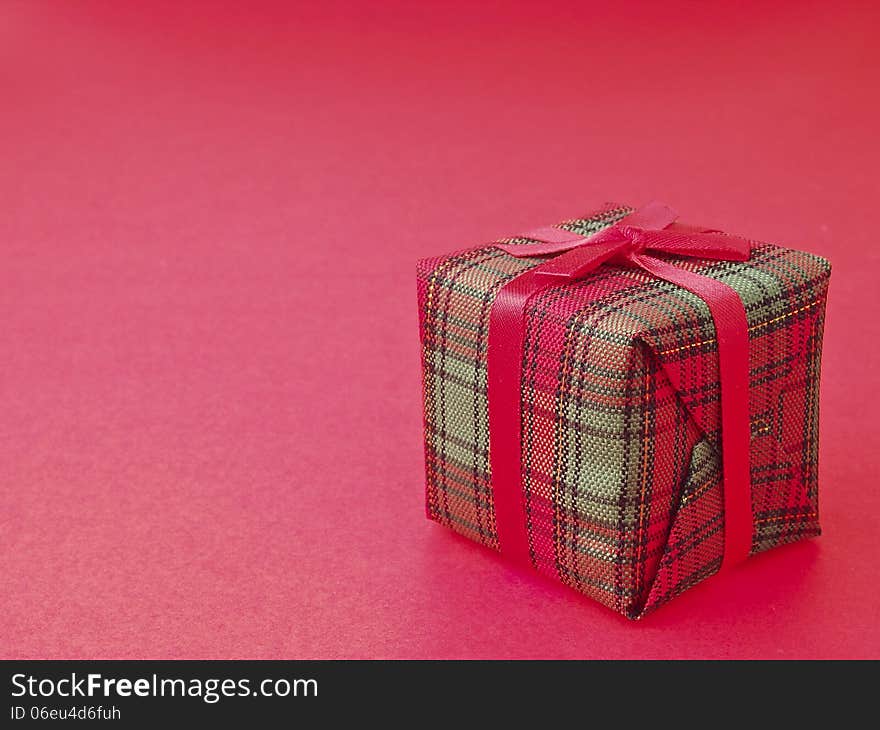 Decorate red gift box on red background. Decorate red gift box on red background