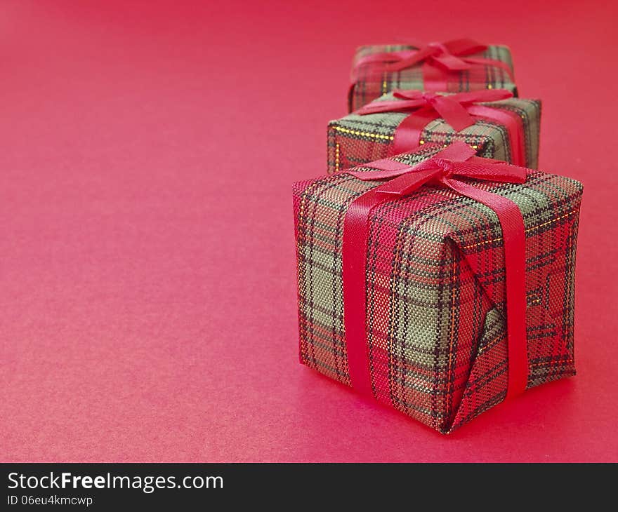 Line arrange of three red gift box on red background. Line arrange of three red gift box on red background