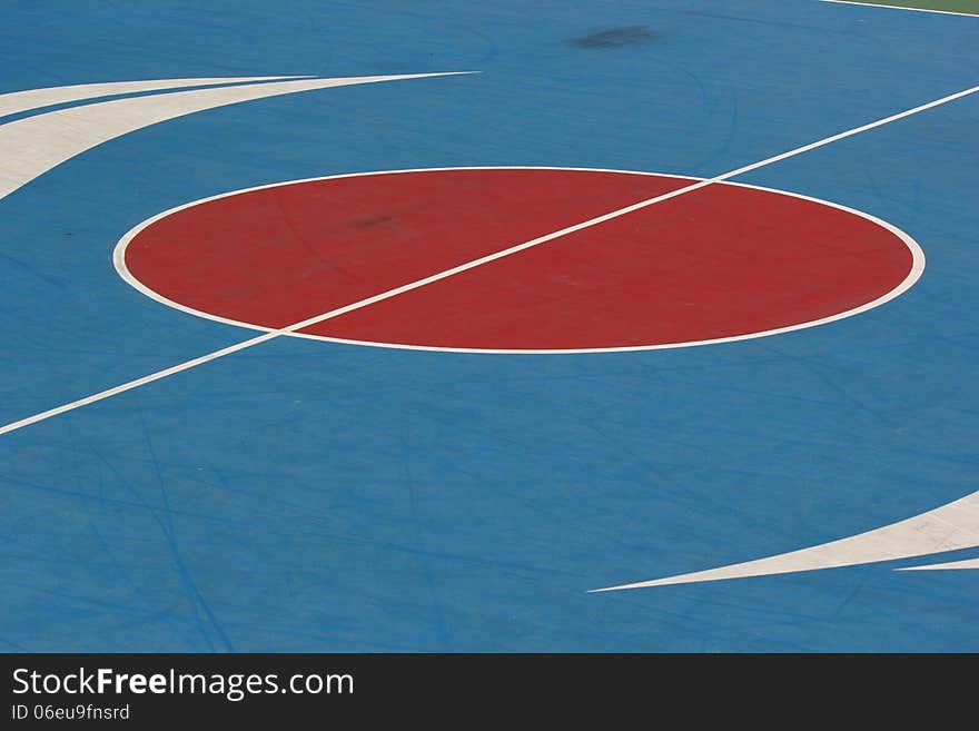 Middle of the basketball court in park. Middle of the basketball court in park