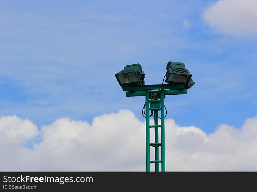 Light poles in the park , spotlights post on blue sky