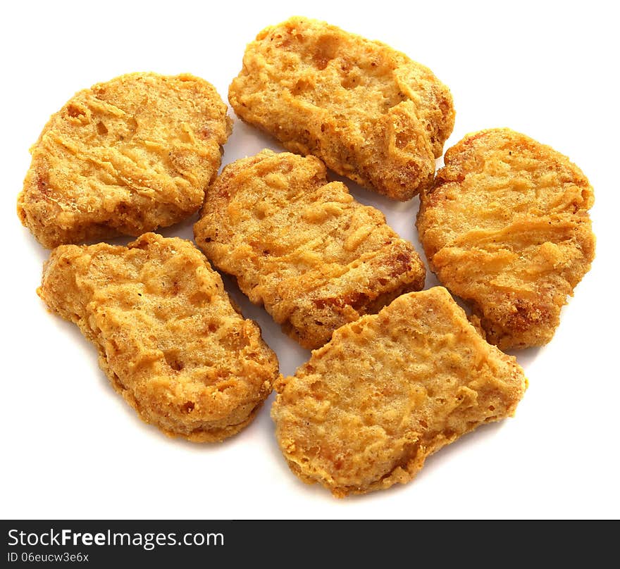 Delicious chicken nuggets on a white background