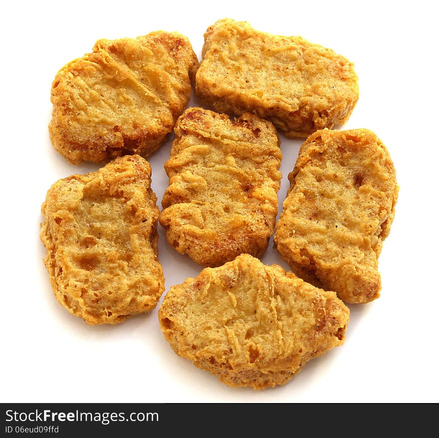 Delicious chicken nuggets on a white background