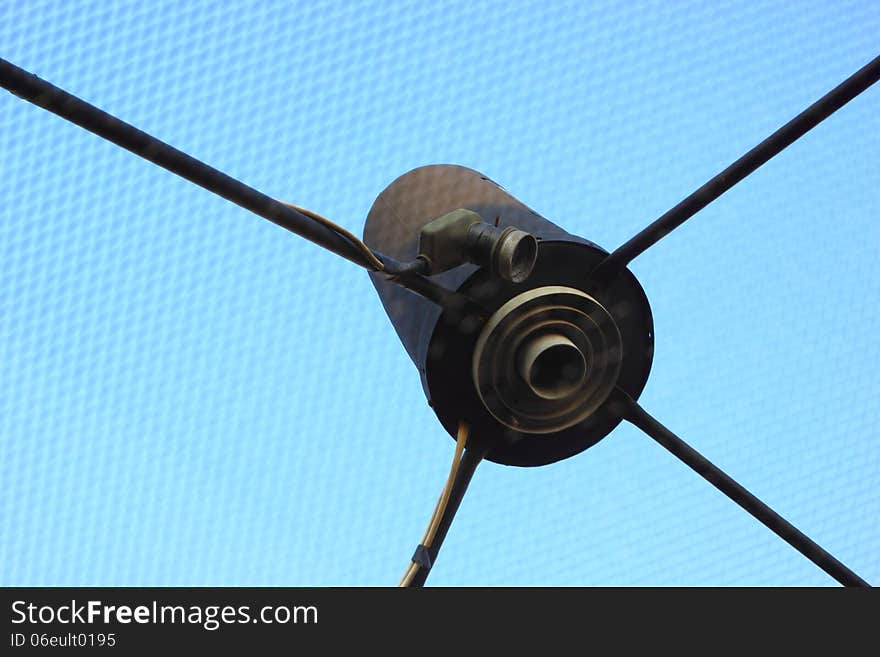 Close up an Satellite receiver dish is an roof.