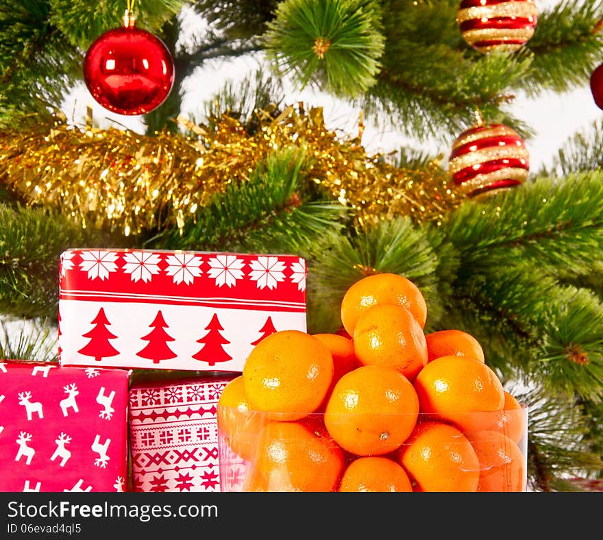 Christmas tree with gifts and presents and mandarines, isolated on white. Christmas tree with gifts and presents and mandarines, isolated on white