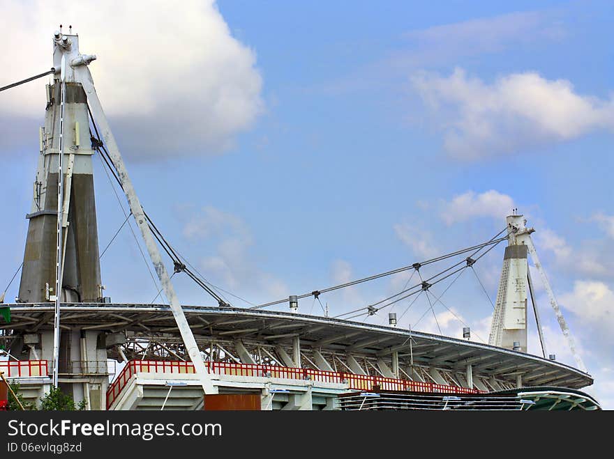 Reinforced concrete structures of large sports facility with supporting pillars and steel cables. Reinforced concrete structures of large sports facility with supporting pillars and steel cables