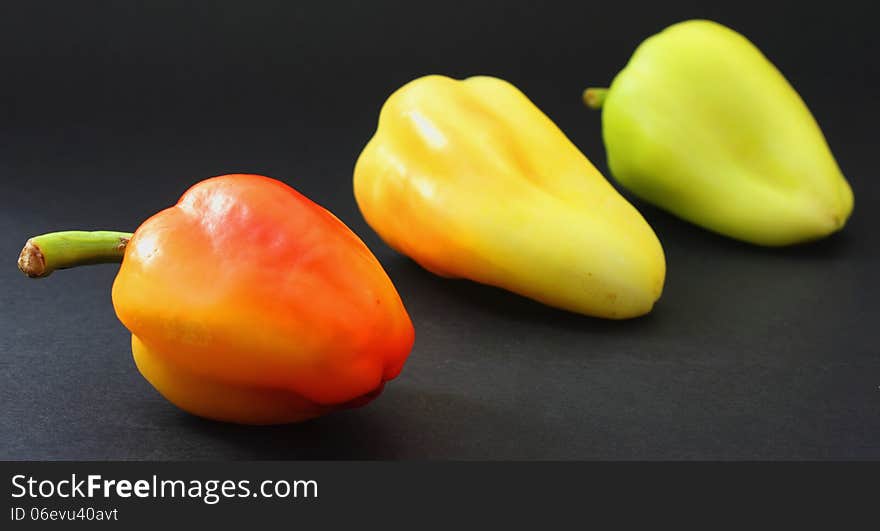 Red peppers on a dark background