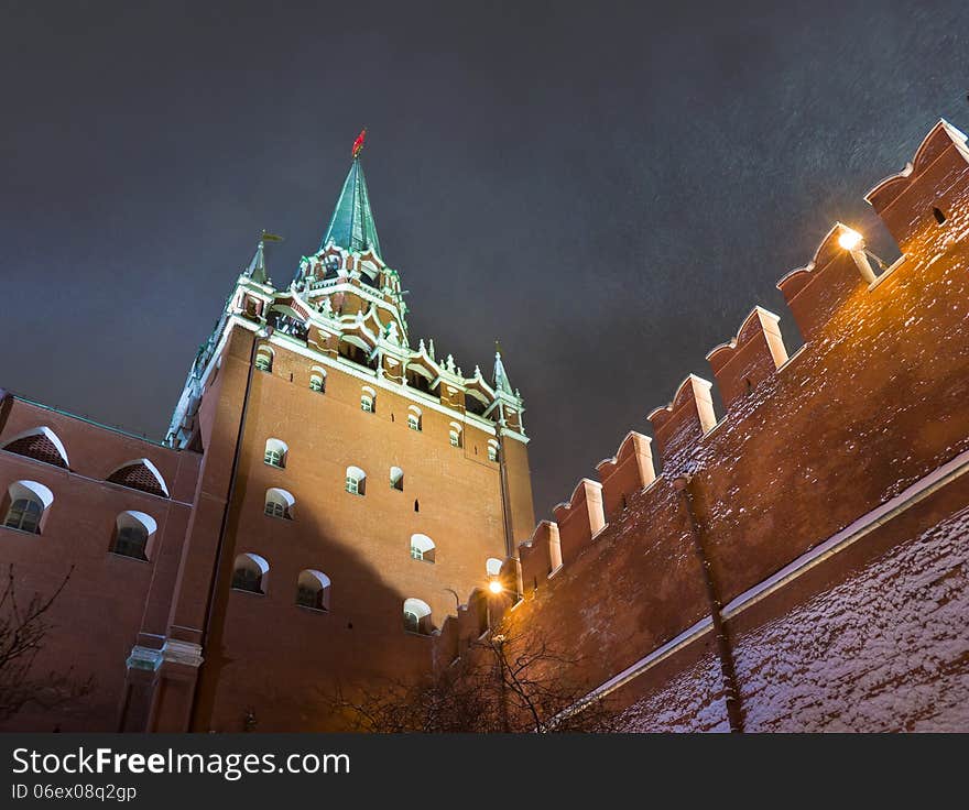 Night snowstorm in Moscow. Trinity Tower - the tallest of the 20 towers that surround the Moscow Kremlin. Russia.