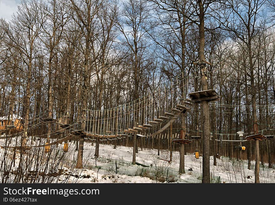 Towable ropes course in the forest in the trees. Towable ropes course in the forest in the trees.