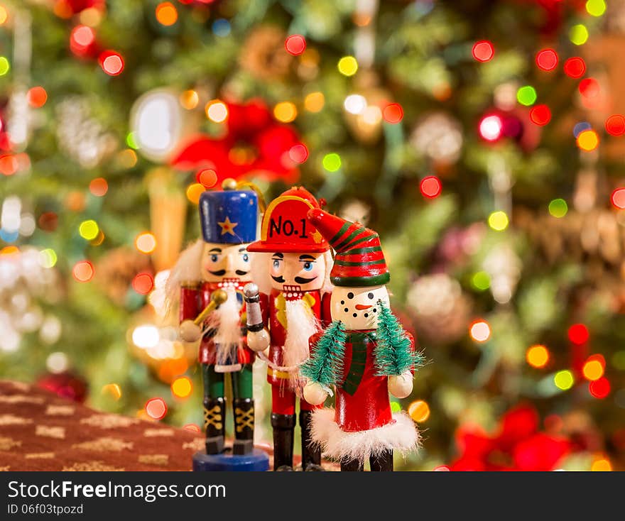 Three christmas figures on the tree background