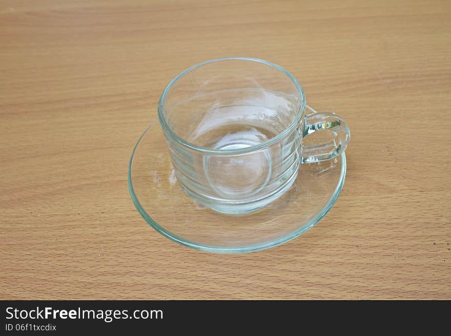 Coffee cup on wood table background