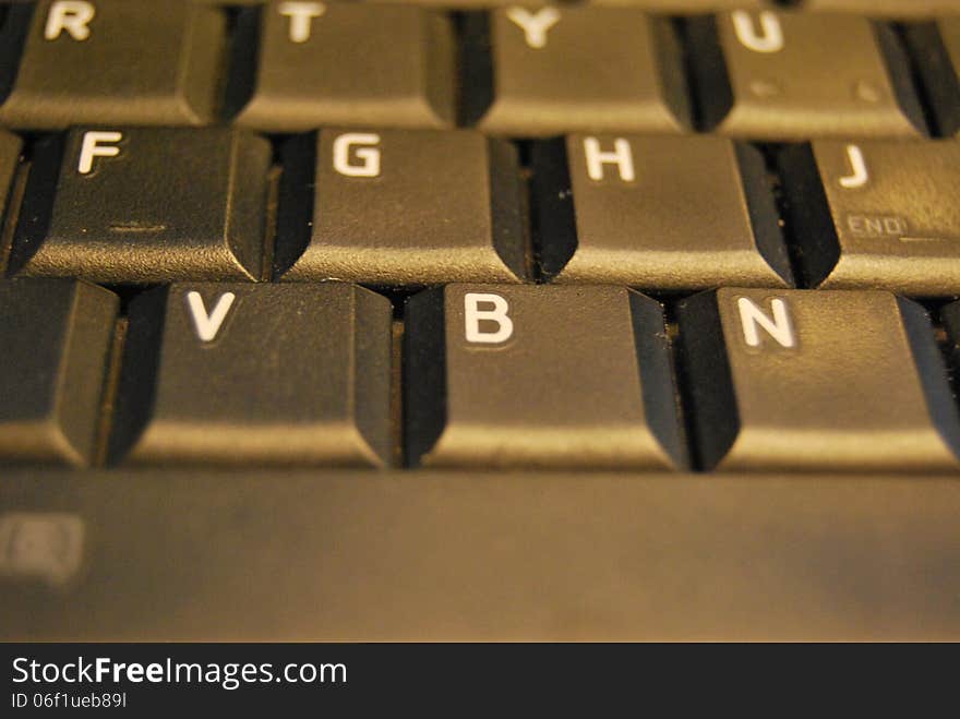 Part of black keyboard and letters