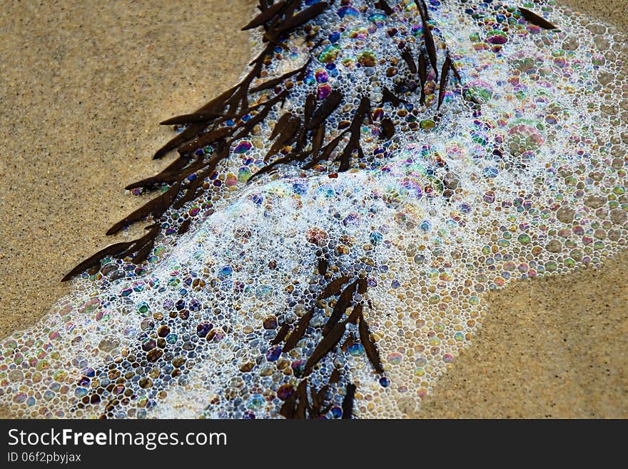 Sea foam on the beaches from recent storms .. the colours in the foam are like thousands of tiny jewels. Sea foam on the beaches from recent storms .. the colours in the foam are like thousands of tiny jewels.