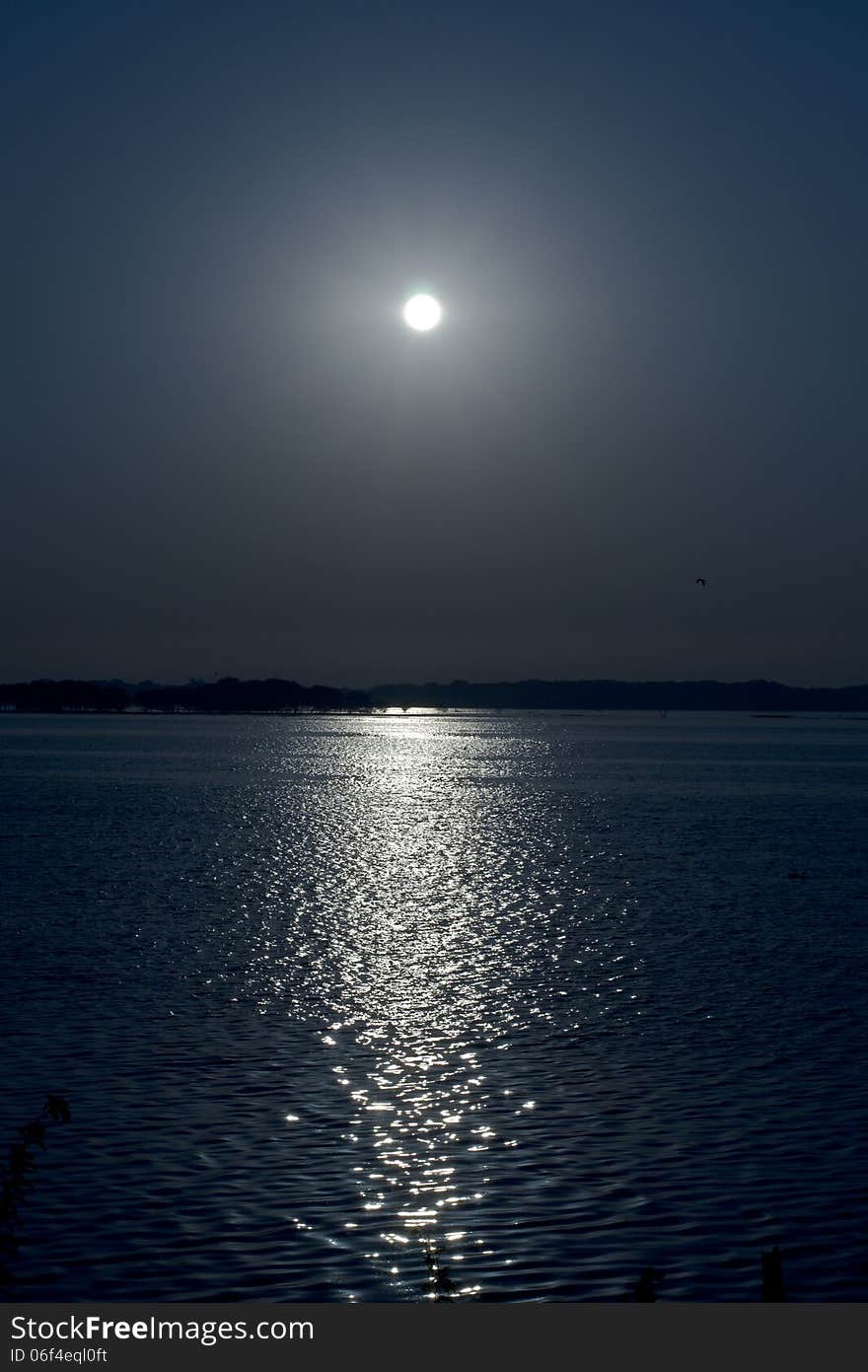 Blue Sky with Sun with its reflection on Water. Blue Sky with Sun with its reflection on Water