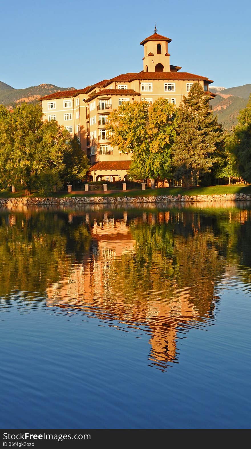 A peaceful pond reflects the Broadmoor hotel. A peaceful pond reflects the Broadmoor hotel