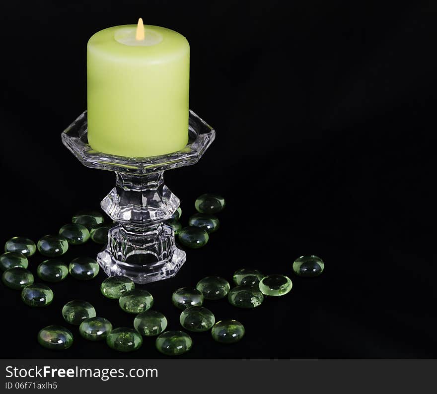 Burning candle on a black background