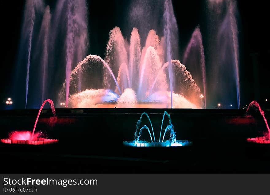 Holiday concept. Nice color fountain on dark background. Holiday concept. Nice color fountain on dark background