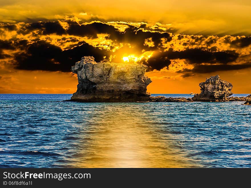 Waves on the sea landscape on a background of blue sky with clouds