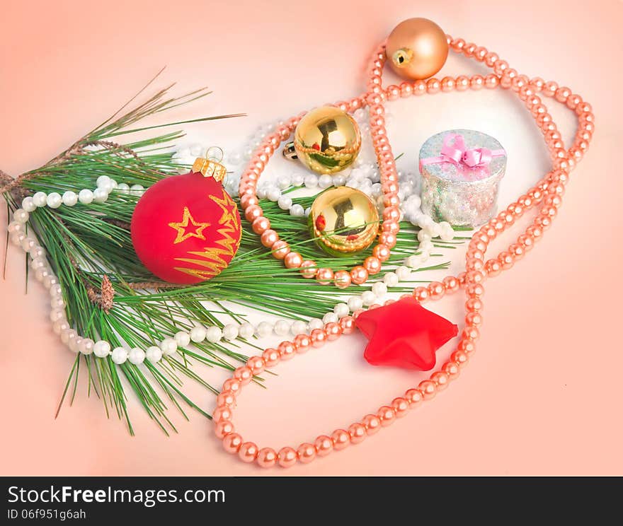 Peach color Christmas background with various Christmas tree decorations