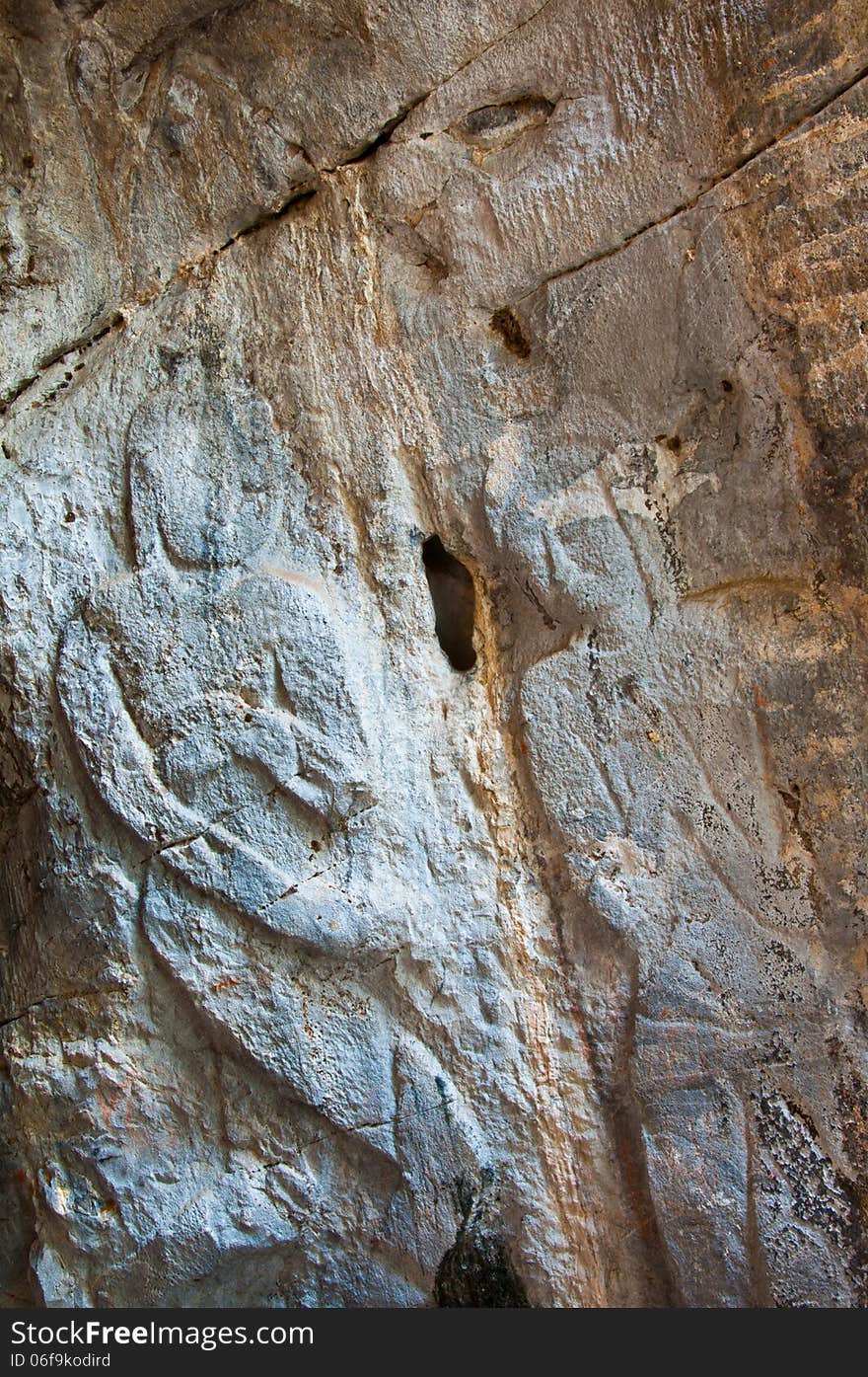 The stucco of ancient angle at the Khao Ngu Cave in Thailand