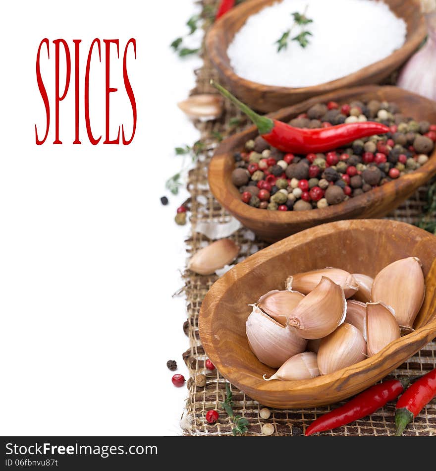 Garlic, hot pepper, sea salt and spices in bowls