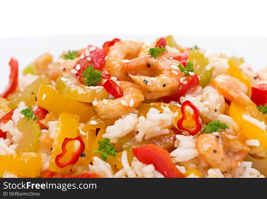 Rice with vegetables and shrimps, close-up, isolated on white