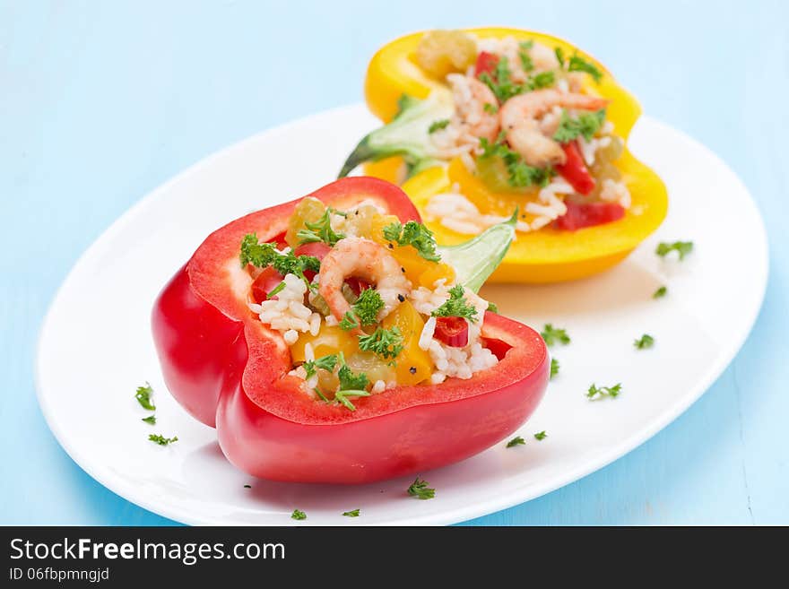 Stuffed Peppers With Salad Of Rice And Shrimp On Blue Background