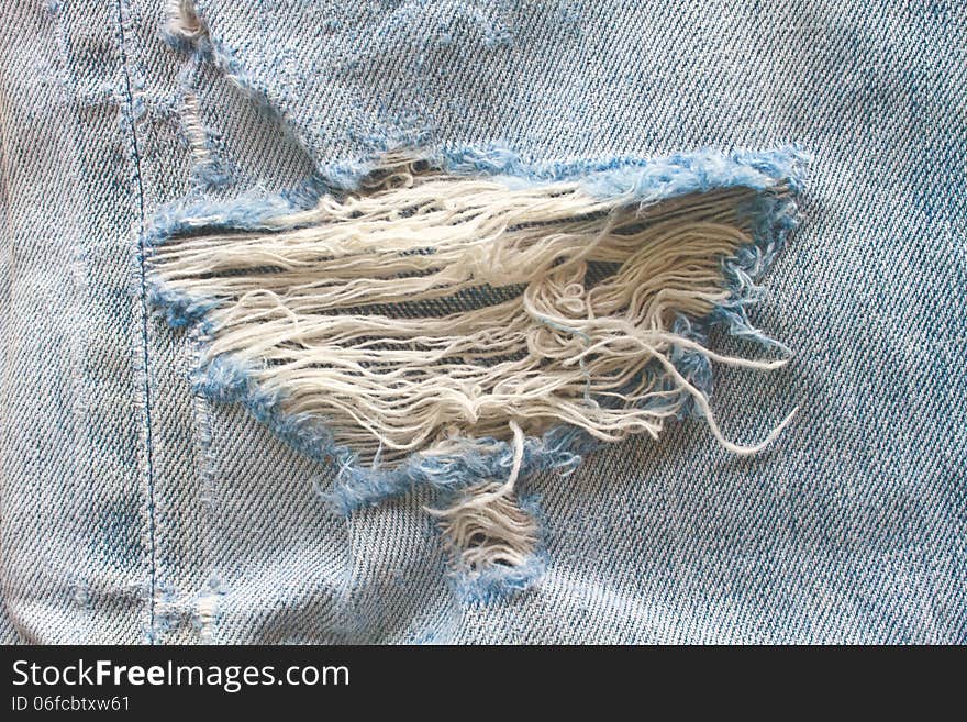 Blue torn denim jeans texture