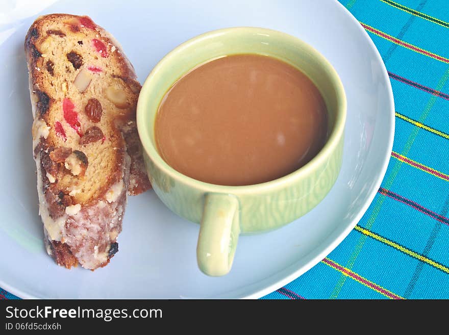 Fruitcake with raisin and Seasoning on table, with hot coffee. Fruitcake with raisin and Seasoning on table, with hot coffee