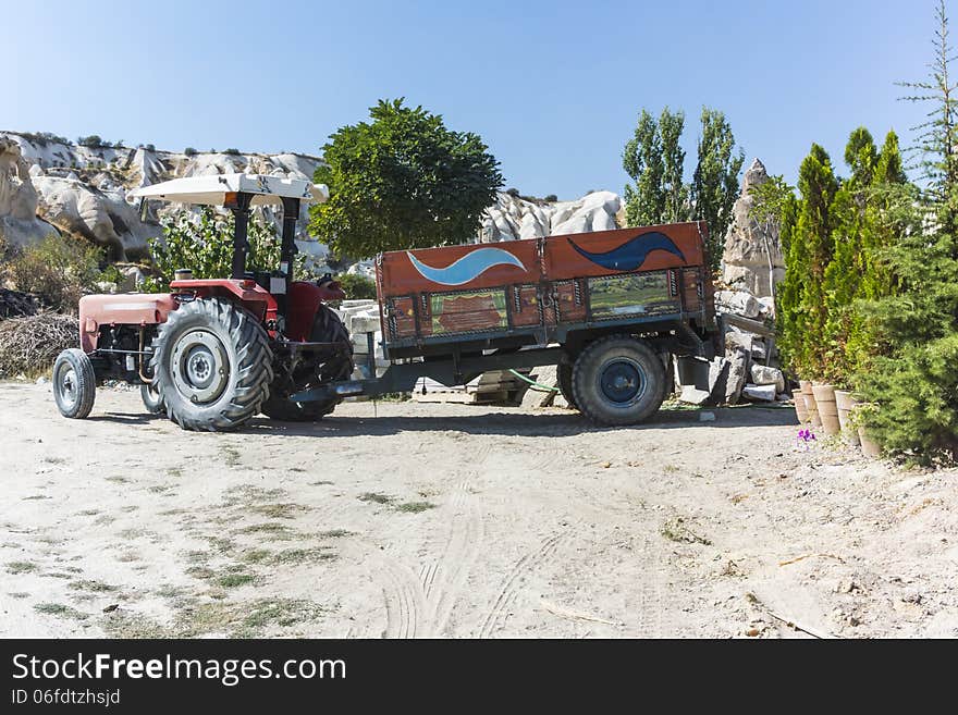 Tractor with trailer in goreme , Cappadocia in central Turkey. In the gardening store. Tractor with trailer in goreme , Cappadocia in central Turkey. In the gardening store.