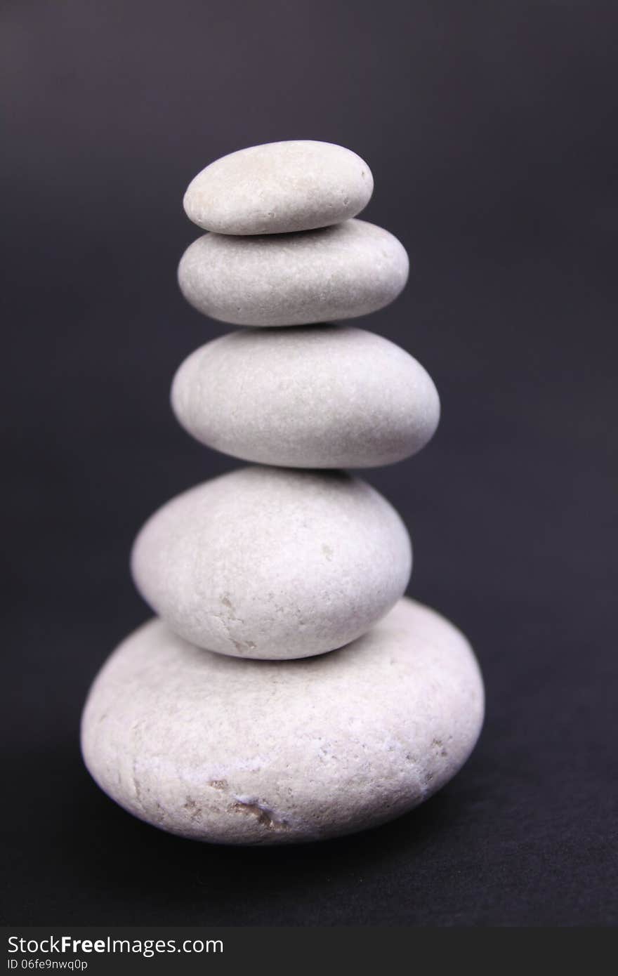 Pyramid of stones on a dark background