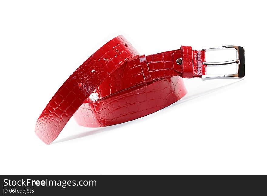 New stylish red leather belt on white background