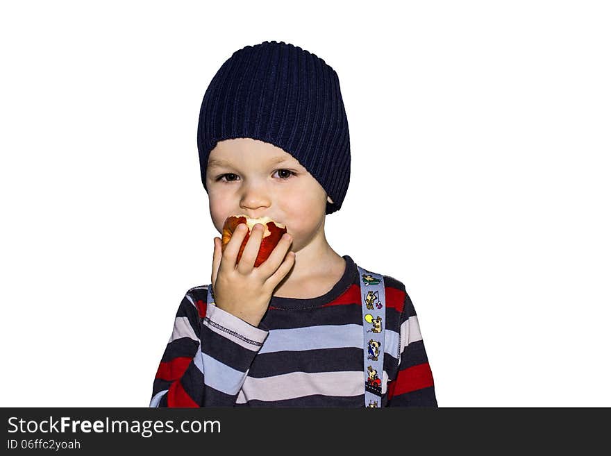 Child with appetite eats red apple. Child with appetite eats red apple