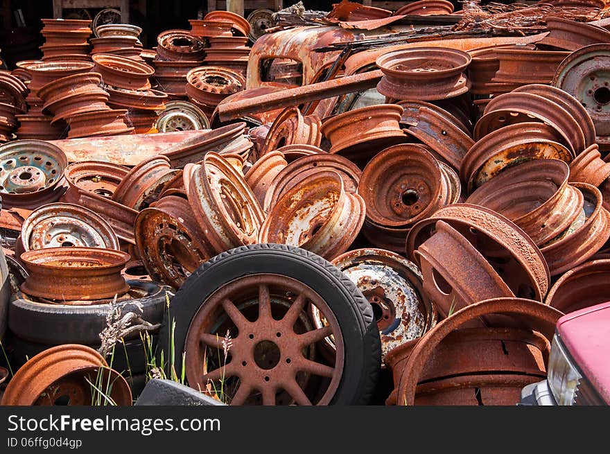 Piles of rusty wheels found in car wreckers