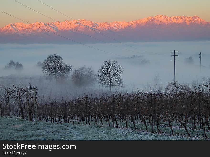 Beautiful winter sunrise on a foggy morning