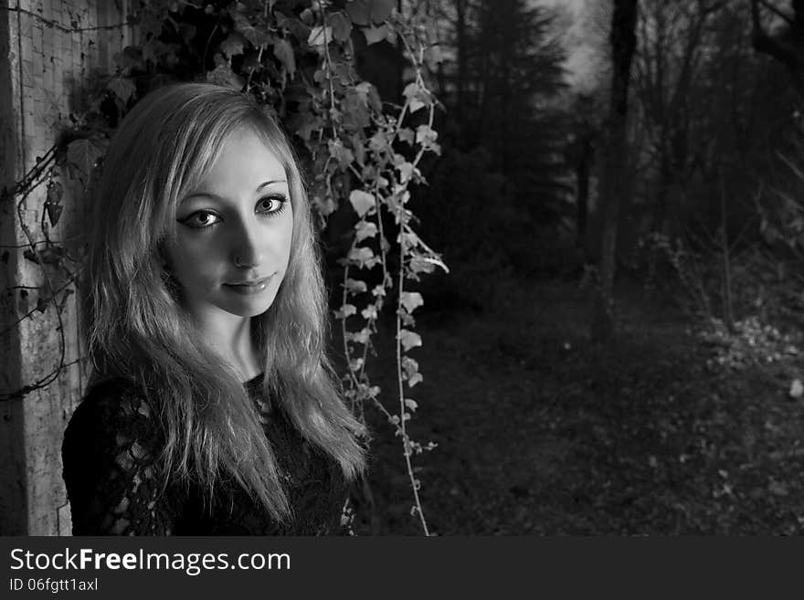 Beautiful young red haired model posing in abandoned buildings. Beautiful young red haired model posing in abandoned buildings