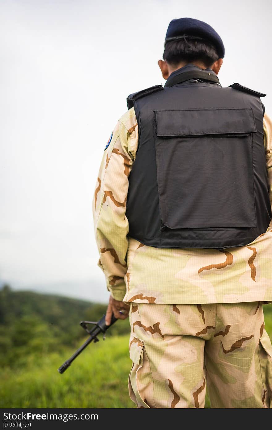 Soldier guardian standing with rifle gun