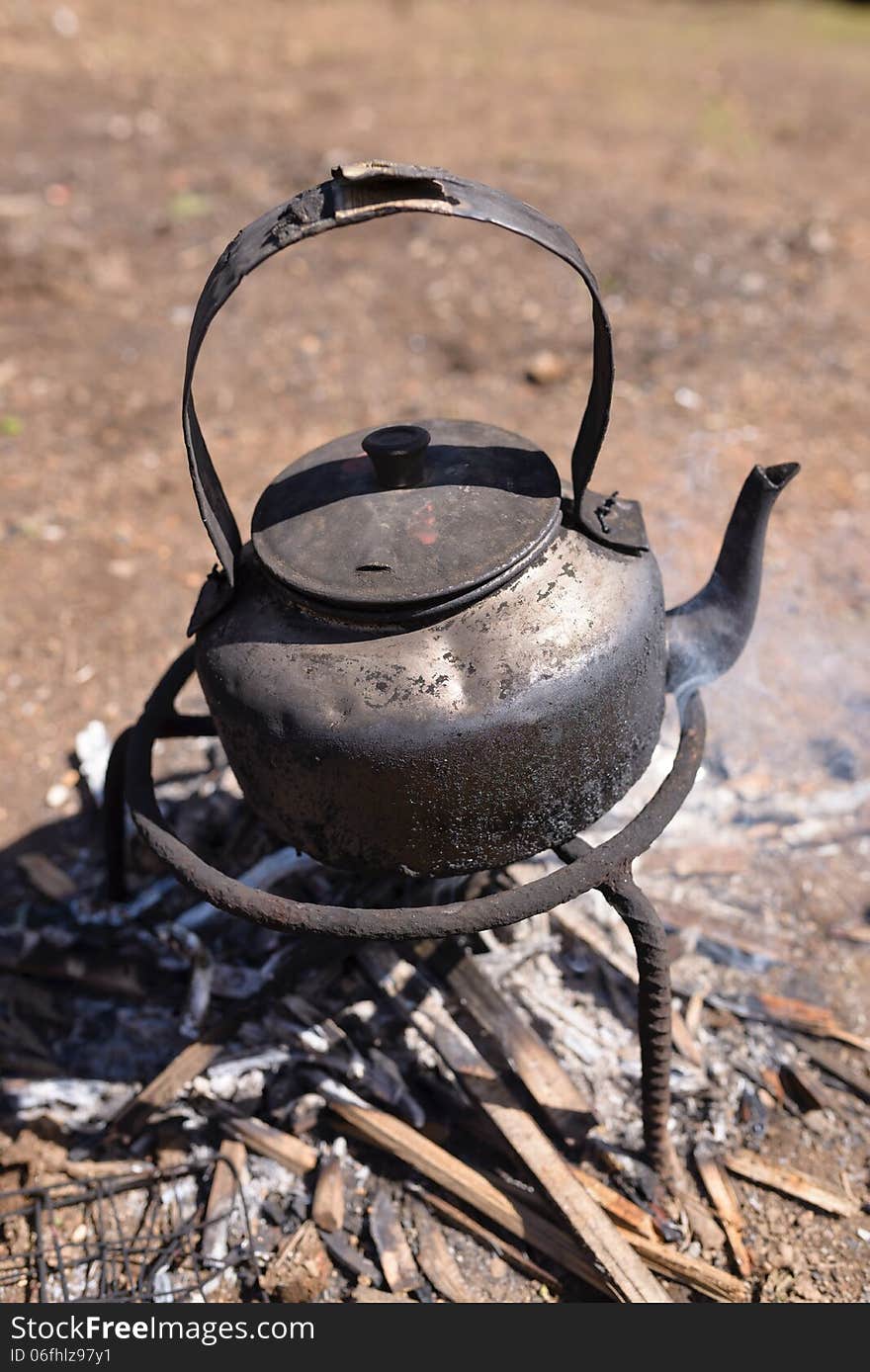 Tea pot on firewood