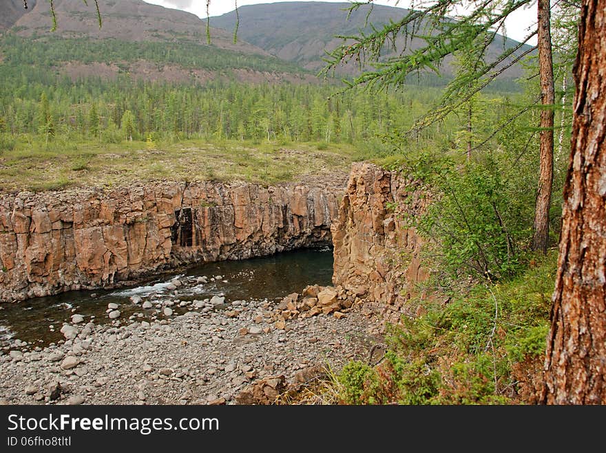 Rocky canyon of the mountain river. Russia, Taimyr Peninsula, Putorana plateau. Rocky canyon of the mountain river. Russia, Taimyr Peninsula, Putorana plateau.