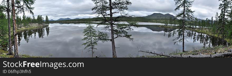 Panorama of lake mountains in the background.