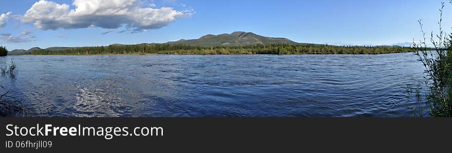 Panorama of lake mountains in the background.