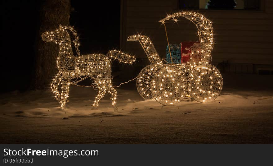 Horse and carriage in christmas lights