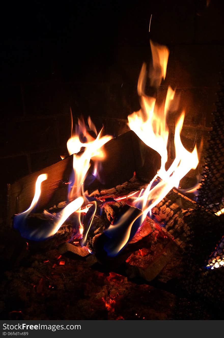 Fire in a fireplace. Closeup picture