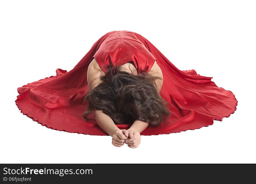 Beautiful woman sitting on the floor, white background