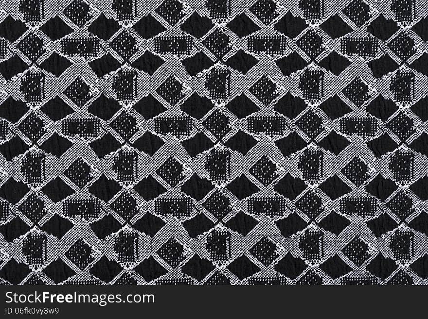 Material in geometric patterns, a textile background.