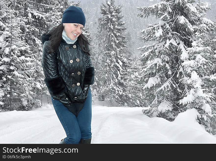 Portrait of a beautiful young girl on a background of a winter forests. Portrait of a beautiful young girl on a background of a winter forests