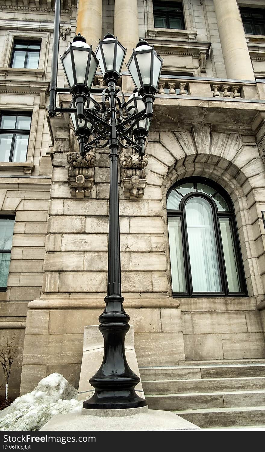 Lampost in front of a historic building downtown Montreal