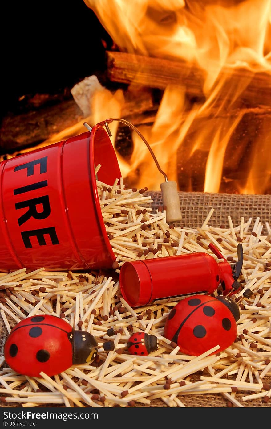 Fire bucket with sign Fire, Flames and matchstick. Fire bucket with sign Fire, Flames and matchstick