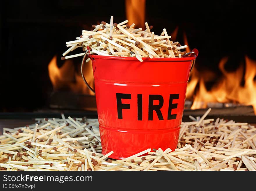 Fire bucket with sign Fire, Flames and matchstick. Fire bucket with sign Fire, Flames and matchstick